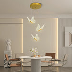 suspension lumineuse moderne or papillons effet lumineux diffus trois têtes