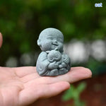 statues moines résine gris texture granulée art artisanal jardin zen serein souriantextérieur decoration