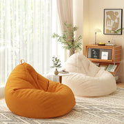 pouf sol tissu texturé orange blanc rose gris décontracté moderne minimaliste repose pieds gris