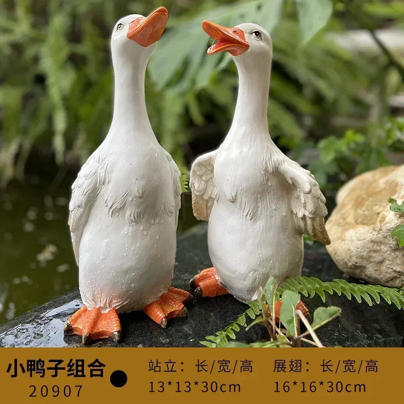 statue canard blanc plumes orange piscine jardin décoration extérieure animaux ornements paysagistes fleurs artificielles