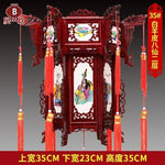 lanterne traditionnelle chinoise bois sculpté rouge décorative pompon fête mariage jardin