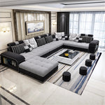 canapé d'angle forme cuir véritable coussins abstraits moderne salon gris noir beige