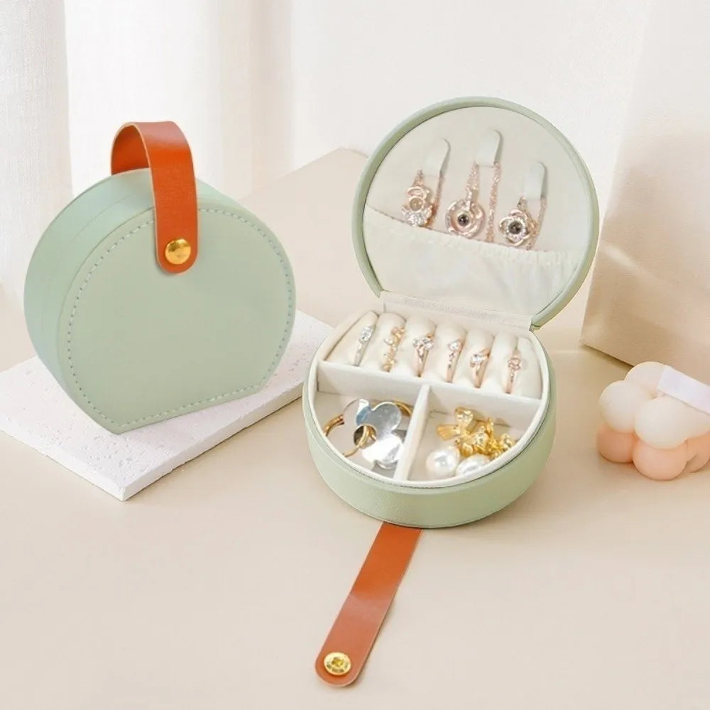 boîte bijoux simili cuir poignée compartiments bagues oreilles colliers vert pastel moderne élégante protection