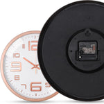 horloge murale moderne chiffres relief aiguilles fines blanc rose doré noir minimaliste