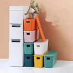 boîtes rangement plastique blanc orange rose vert bleu jaune moderne poignées couvercle