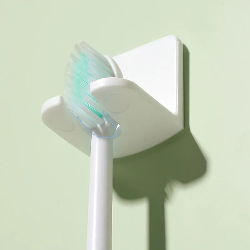 supports muraux adhésifs brosses dents blanc rose bleu moderne salle bain organisateur économie espace
