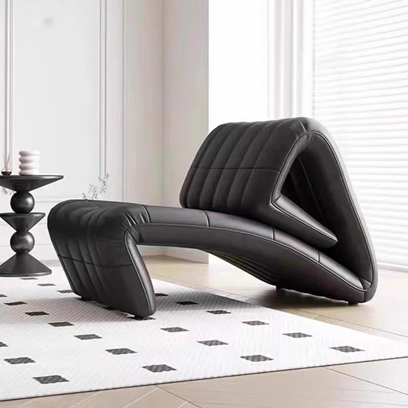 fauteuil contemporain cuir noir repoussé coussin blanc rayures canapé minimaliste maison salon italien