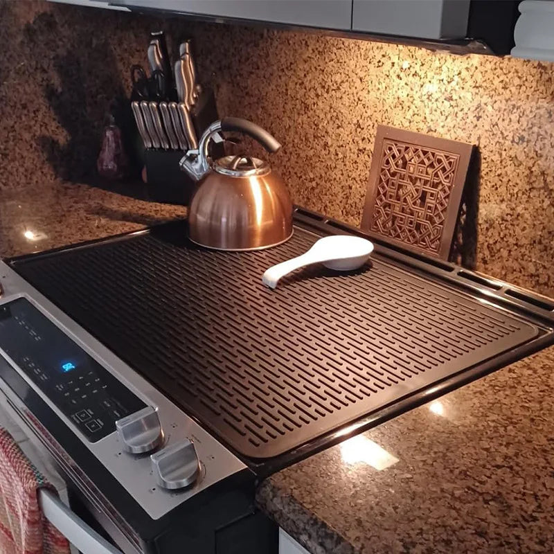 tapis protection silicone antidérapant chauffe plaque induction noir rayures horizontales moderne adhésif respectueux environnement