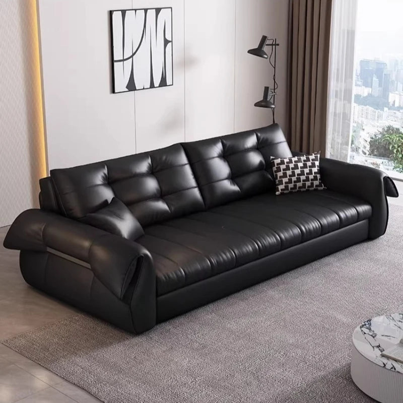 canapé lit noir simili cuir moderne coussin décoratif table basse tapis couverture