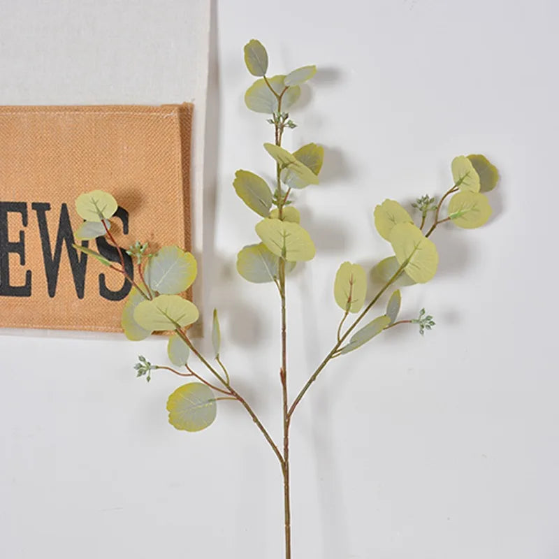 décoration intérieure branche artificielle feuilles ovales vert rose naturel minimaliste