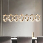 lampe suspendue dorée contemporaine effet miroir chaînes brillance éléganteintérieur salon cuisine doré