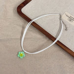 boucles doreilles tressées collier fleurs plumeria ensemble bijoux femmes moderne minimaliste blanc vert rose