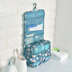 Sac toilette pliable oxford imprimé floral bleu clair motifs blancs roses bleus moderne pratique