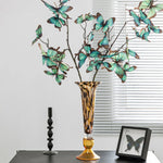 vase verre ambré motif moucheté moderne décoration intérieure bougie papillon fleurs violettes chandelier