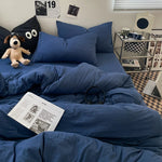 Housse de couette 150x200 en coton délavé bleu sur un lit