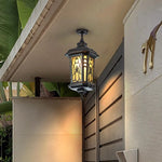 lampe rue classique verre teinté noir doré motifs floraux éclairage extérieur résistant intempéries