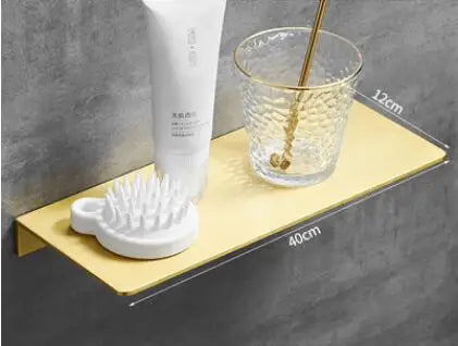 étagère murale moderne dorée lisse trois niveaux vis fixations salle bain aluminium