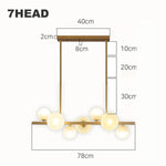 suspension lumineuse moderne or blanc boules translucides chaines interrupteur tactile