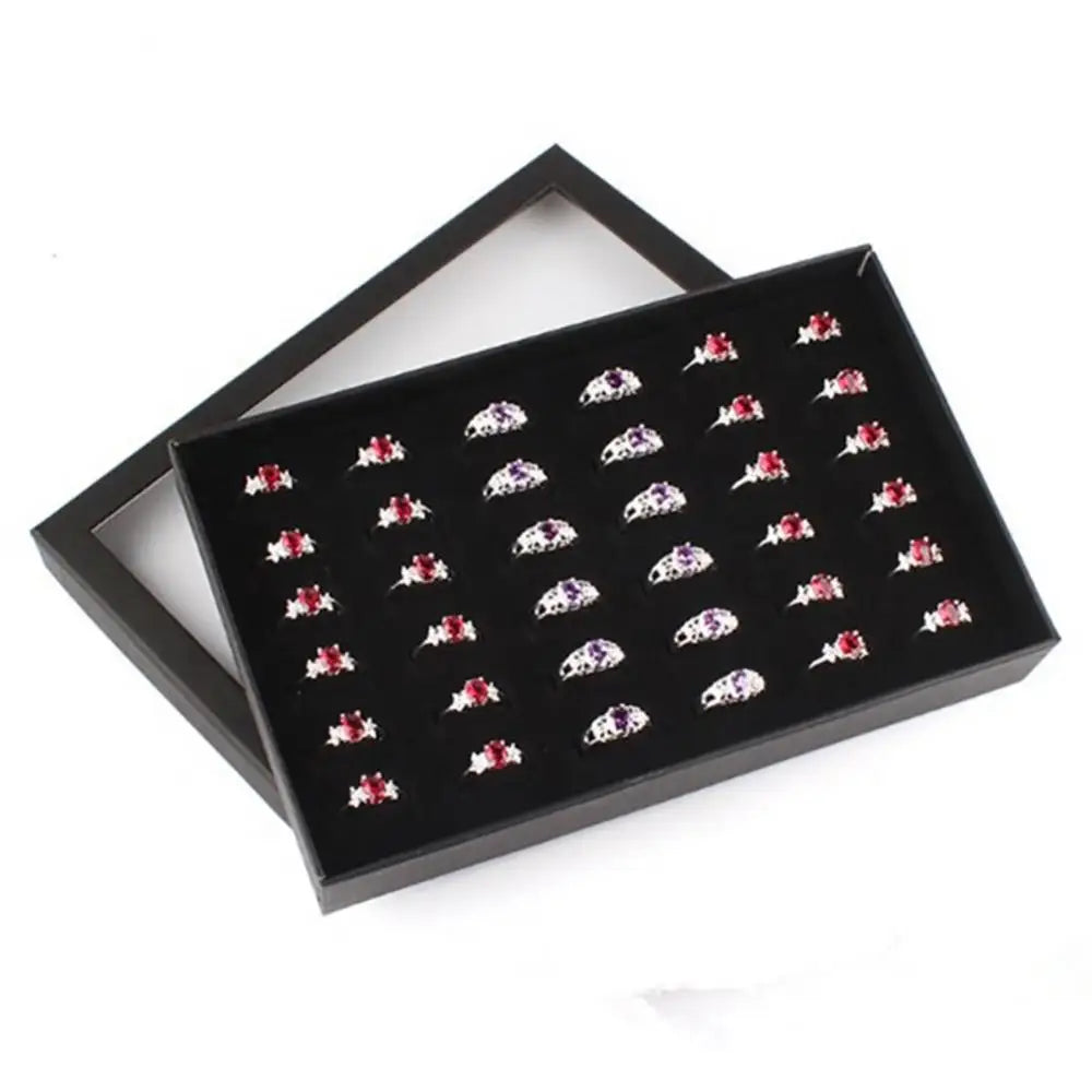boîte rangement bijoux velours noir contemporaine compartiments anneaux boucles doreilles organisation présentoir