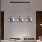 suspension pendentif noir transparent moderne têtes ambrées têtes noires flux lumineux 249 2000 autonome