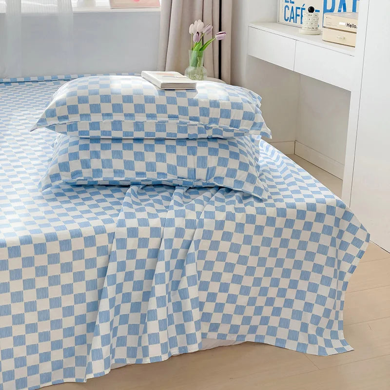 drap lit plat coton bleu clair blanc carreaux géométriques moderne deux oreillers