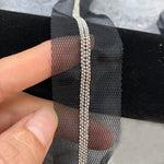 ruban dentelle polyester gris noir maille hexagonale bordure dorée adhésif couture moderne decoration textile