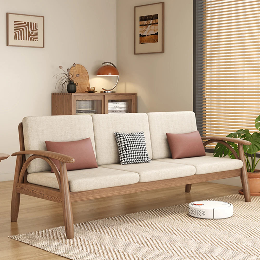 canapé places scandinave beige clair fauteuil pied poule moderne tapis géométrique terracotta blanc