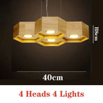 lumière suspendue bois clair nid d'abeille hexagonal modernes led câbles argentés structure géométrique