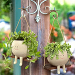 pots fleurs suspendus resine forme personnages souriants balançoire crème marron