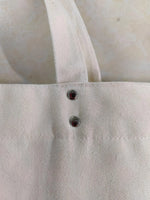 sac main blanc uni moderne poche téléphone poignées fermeture glissière boutons