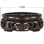 support bois ornements sculptés complexe artisanal marron foncé traditionnel décoration maison objet décoratif stand