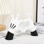 support bijoux main stylisée coeurs blancs résine noire moderne anneaux dorés decoration house
