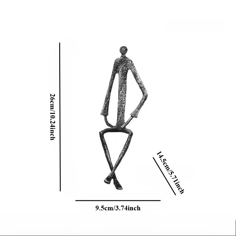 statues modernes minimalistes figures humaines assises noir texture brut forge lunettes livresintérieur