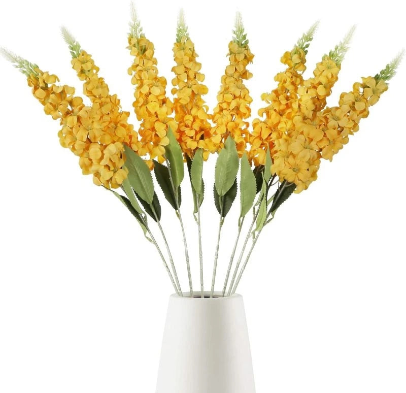 décoration intérieure bouquet artificiel moderne élégant vase livres bougies anniversaire mariage baby shower