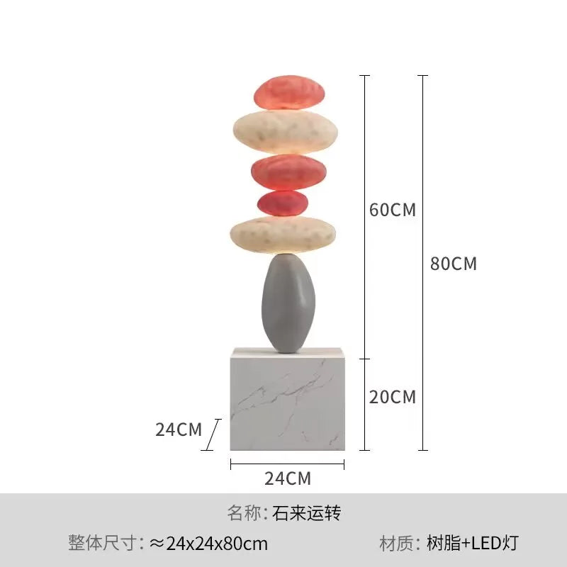 décoration intérieure sculpture pierre équilibrée socle marbre nuance beige contemporain minimaliste salon chambre