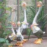 statues canards blanc beige vert sculpture animaux détails décorative jardin rustique textures résine