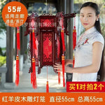 lanterne traditionnelle chinoise bois sculpté rouge décorative pompon fête mariage jardin