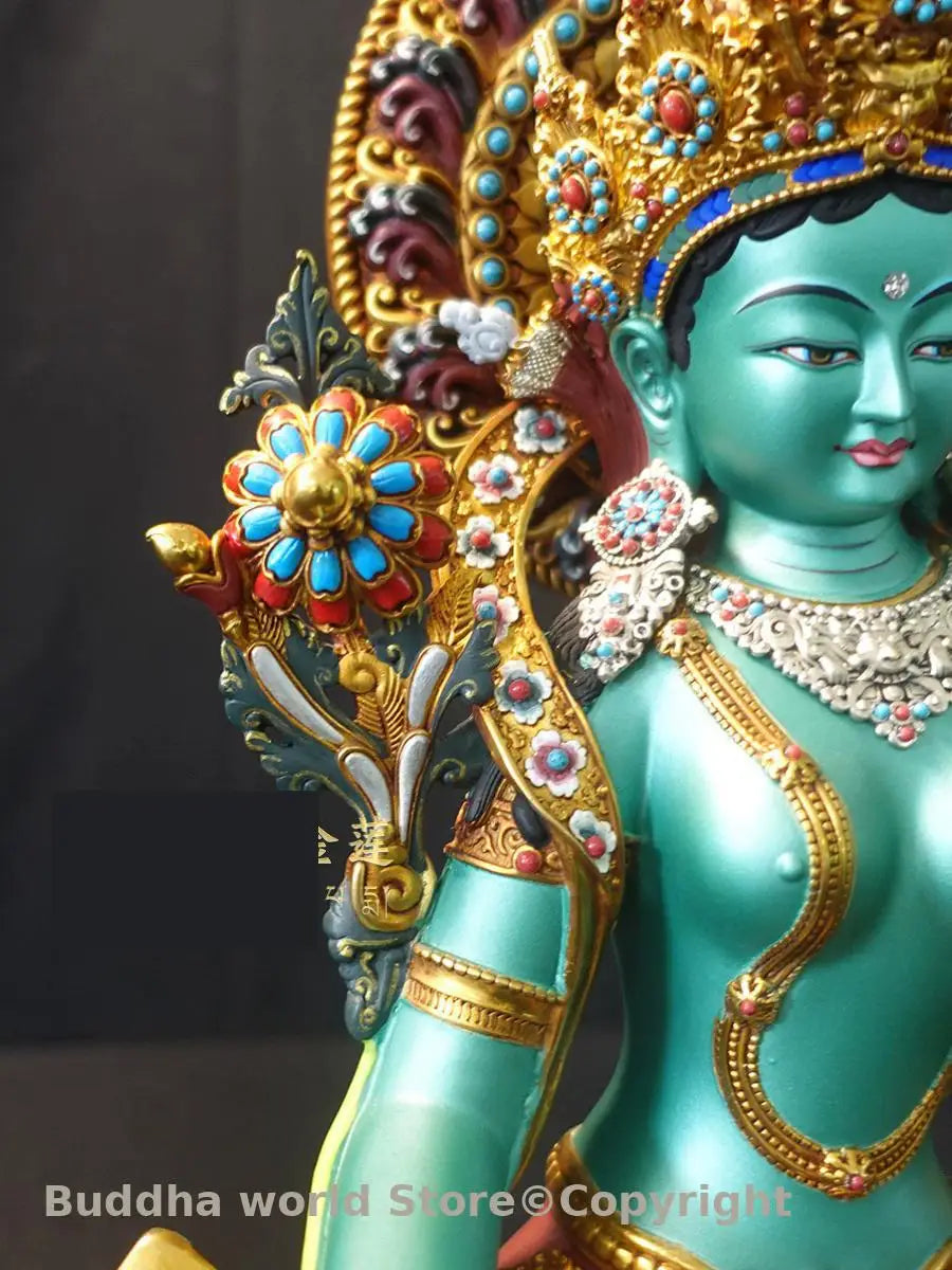statue bouddhiste tara verte cuivre détails floraux motifs géométriques art tibétain doré