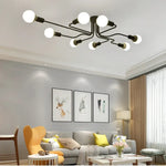 lampe suspension noir blanc moderne scandinave ampoules structure métallique fixations câbles noirs