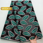 tissu dentelle polyester nylon largeur 51 pouces motifs feuilles stylisées couleurs noir vert rose