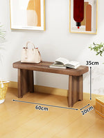 Banc bois marron clair texture naturelle moderne salon tabouret sac main livre ouvert decoration