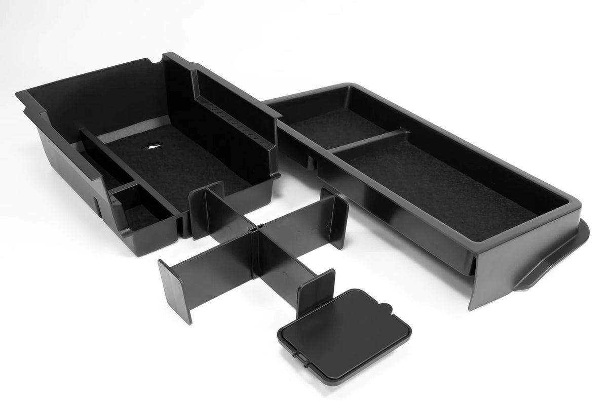 boîte rangement console centrale noire texture mat contemporaine clips fixations compartiments latéraux central lumière