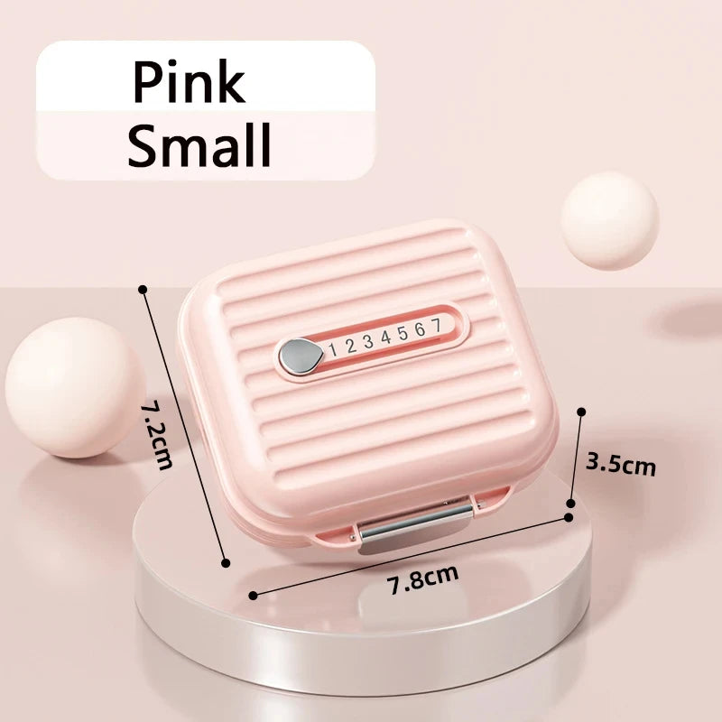 boîte pilules rose violet blanc compartiments rayures moderne pratique poignée rangement médicaments bijoux