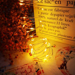 guirlande lumineuse flexible led jaunes vases fleurs séchées papier kraft maquette bateau cheval bascule
