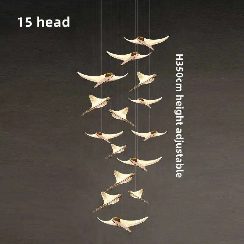 suspension lumineuse or oiseaux stylisés contemporaine minimaliste salon chaînes fixations métal lumière blanche chambre