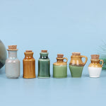 bouteilles vintage céramique bouchons liège vert beige gris clair mat brillant opaques jouet cuisine