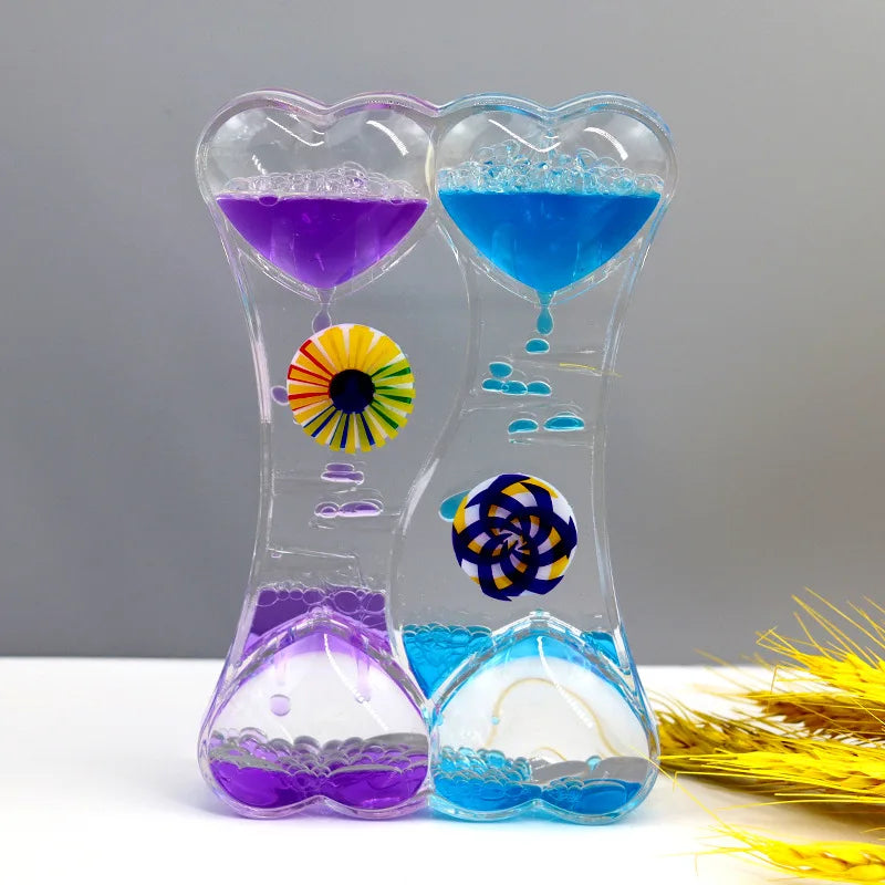 minuteur sablier liquide bicolore transparent motifs géométriques souriant deco moderne