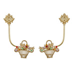 Deux élégantes barrettes à cheveux dorées ornées de corolle de fleurs multicolores et de feuilles dorées, disposées de part et d'autre d'un espace blanc.