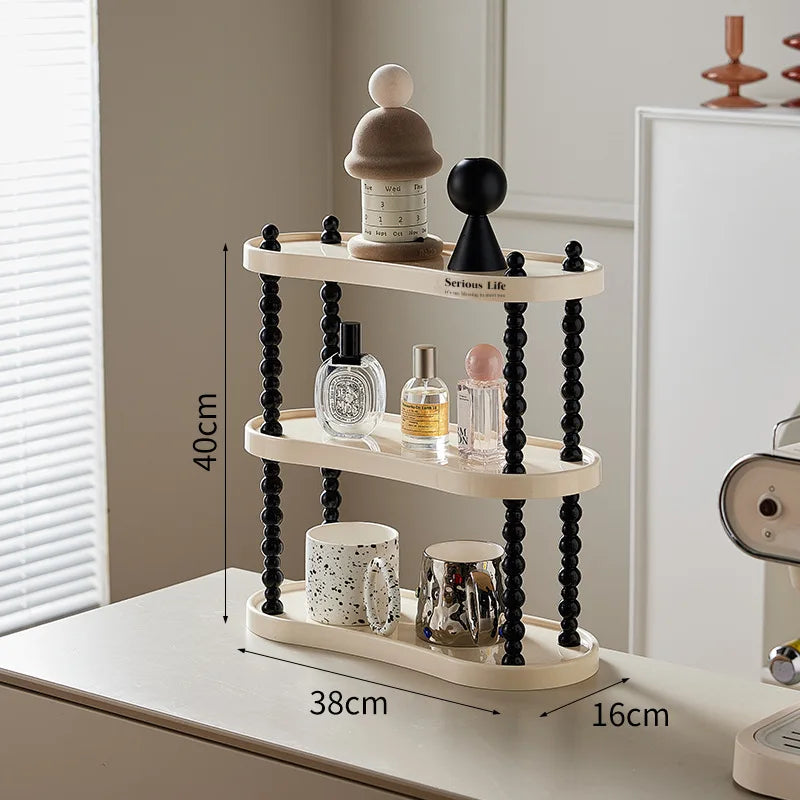 étagère trois niveaux moderne minimaliste blanc noir cosmétiques parfums tasses blancs