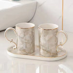 ensemble vaisselle salle bain marbre blanc gris or classique tasses poignées dorées porte brosse